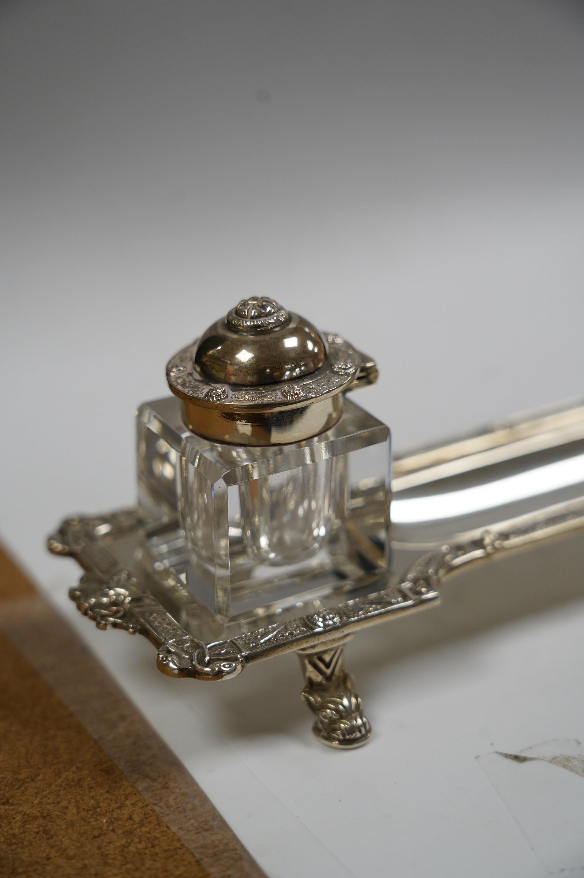 A modern silver inkstand with Celtic border and two mounted glass wells, Adie Bros. Birmingham, 1962, 26.3cm, 6.5oz. Condition - fair